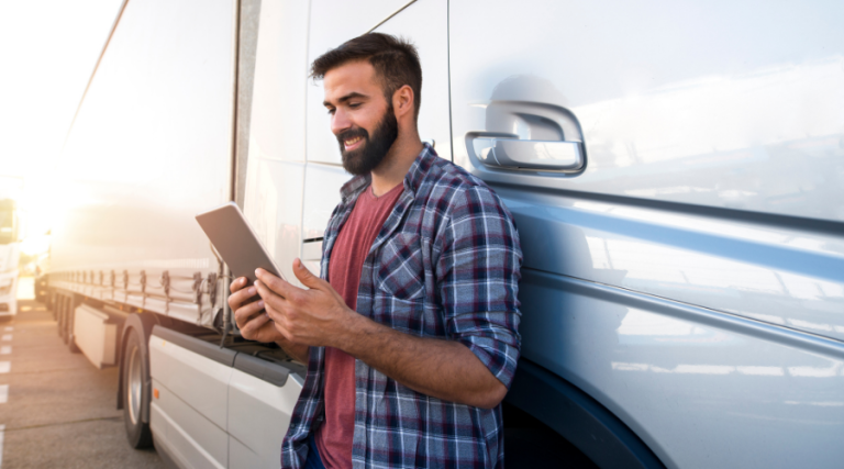 trucker using mobile freight broker software on the go