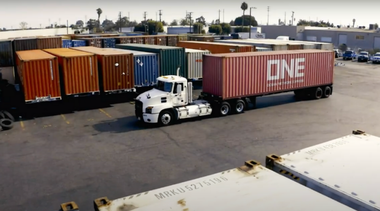 drayage truck in lot with containers